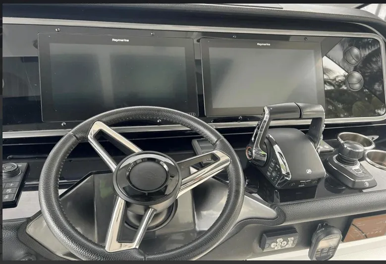  Yacht Photos Pics Helm of 2022 Azimut Verve 42 yacht with dual Raymarine displays and steering wheel.