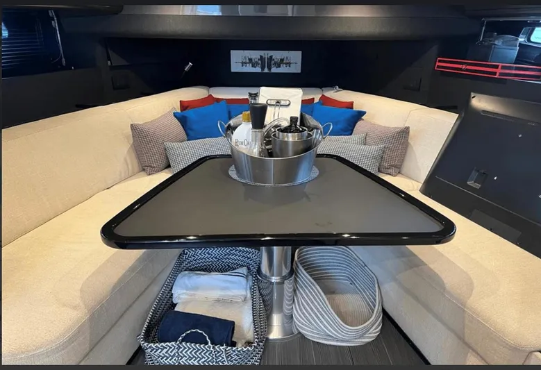  Yacht Photos Pics Luxurious interior of 2022 Azimut Verve 42 yacht with elegant seating and table setup.