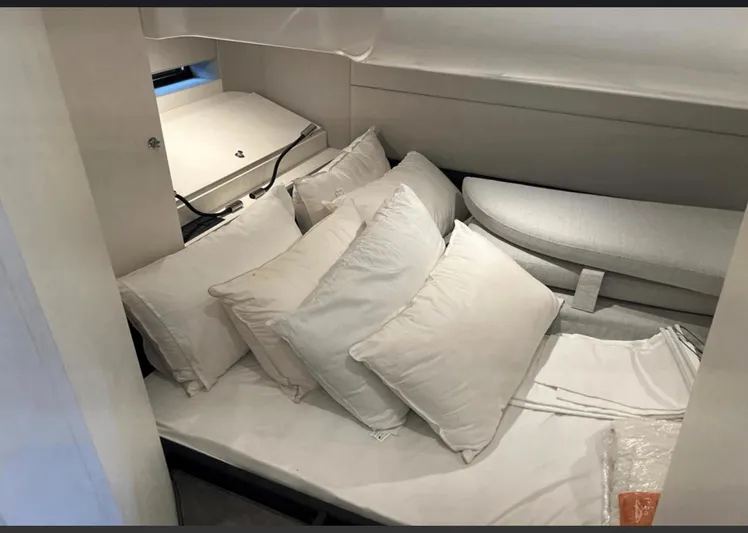  Yacht Photos Pics Cozy cabin interior of 2022 Azimut Verve 42 yacht with plush pillows and modern design.