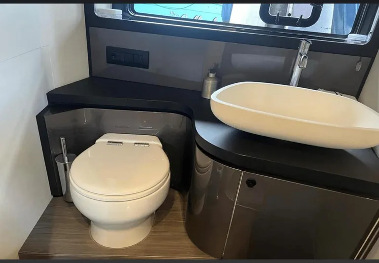  Yacht Photos Pics Modern bathroom in 2022 Azimut Verve 42 yacht with sleek sink and toilet.