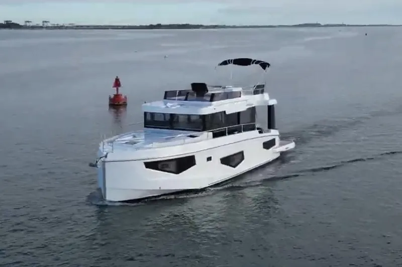 Your New Boat Yacht Photos Pics 2026 Cobra Yachts Seamaster 45 cruising on open water, showcasing sleek design and modern features.