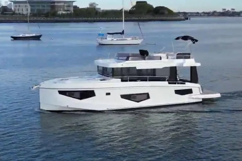 Your New Boat Yacht Photos Pics 2026 Cobra Yachts Sea Master 45 cruising on a calm waterway.