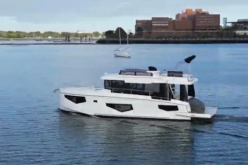 Your New Boat Yacht Photos Pics Cobra Yachts Sea Master 45, 2026 model, cruising on a serene waterway.