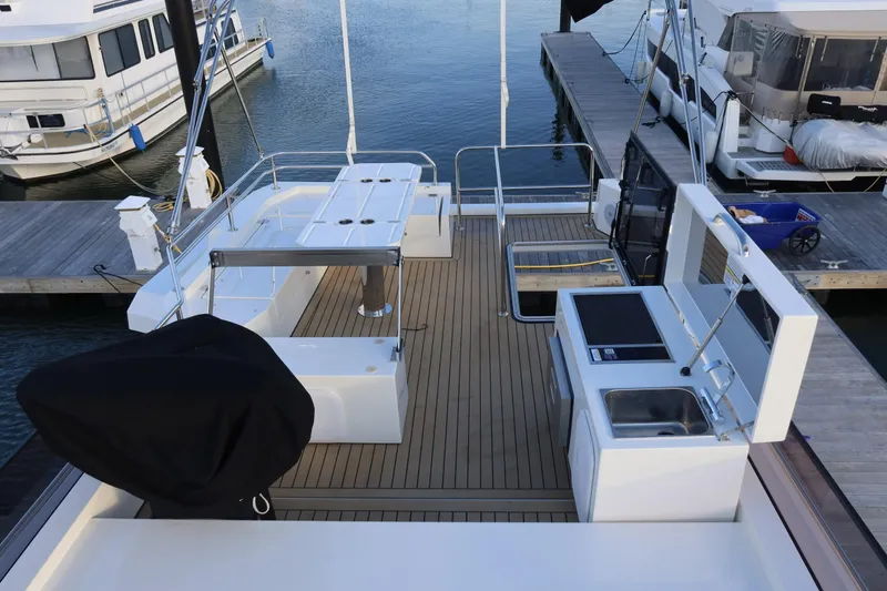 Your New Boat Yacht Photos Pics Luxury Cobra Yachts Sea Master 45 deck with modern amenities, docked at marina, 2026 model.