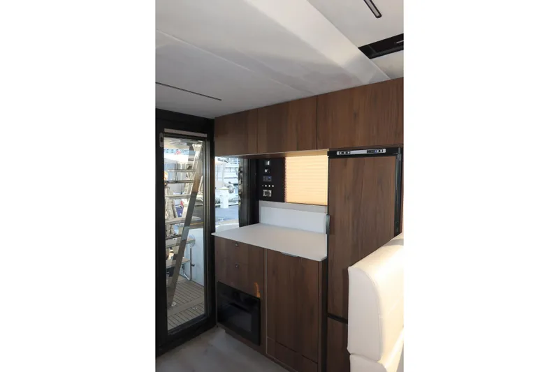 Your New Boat Yacht Photos Pics Modern interior of 2026 Cobra Yachts Sea Master 45 with sleek wood cabinetry.