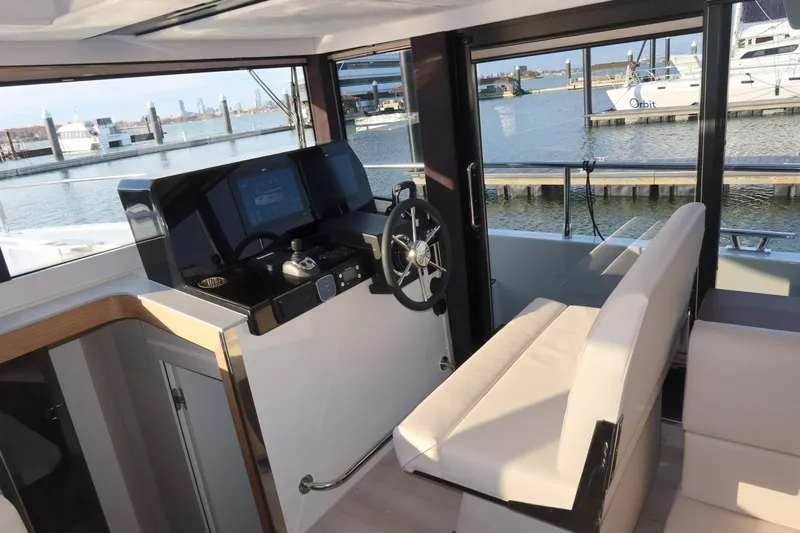 Your New Boat Yacht Photos Pics Interior of 2026 Cobra Yachts Sea Master 45, featuring modern helm and waterfront view.