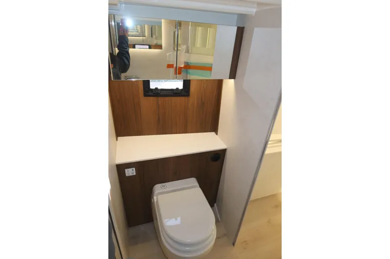 Your New Boat Yacht Photos Pics Modern bathroom in 2026 Cobra Yachts Sea Master 45 with sleek design and wood accents.