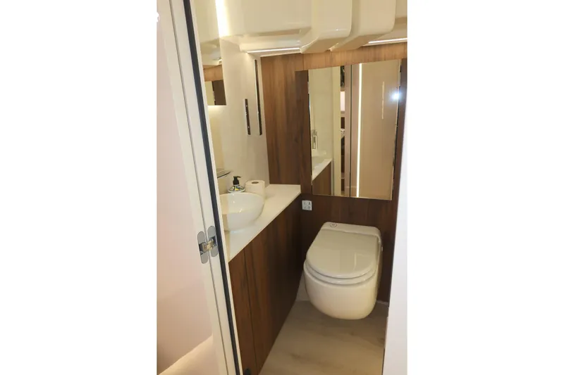 Your New Boat Yacht Photos Pics Modern bathroom in 2026 Cobra Yachts Sea Master 45, featuring sleek design and wood accents.