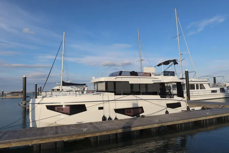 Your New Boat Yacht Photos Pics Cobra Yachts Sea Master 45, 2026 model, docked at marina under clear blue sky.