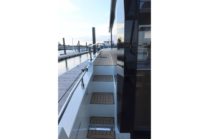 Your New Boat Yacht Photos Pics Cobra Yachts Sea Master 45, 2026 model, docked with elegant deck stairs.