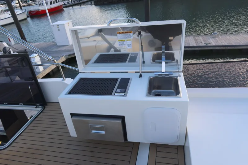 Your New Boat Yacht Photos Pics Outdoor kitchen on 2026 Cobra Yachts Sea Master 45, featuring grill and sink.