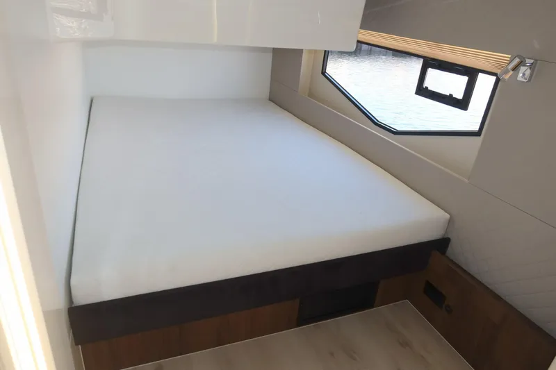 Your New Boat Yacht Photos Pics Modern cabin interior of 2026 Cobra Yachts Sea Master 45 with a cozy bed.