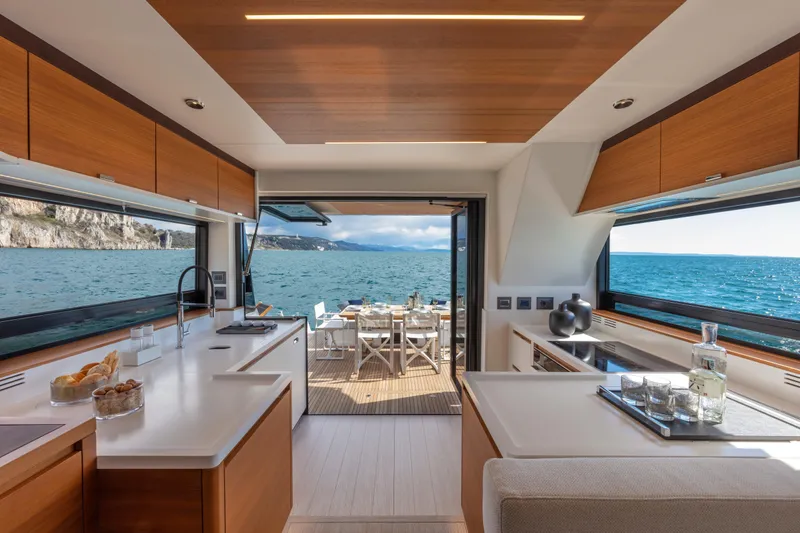  Yacht Photos Pics Luxurious interior of 2026 Pardo Yachts E60 with ocean view and modern kitchen.