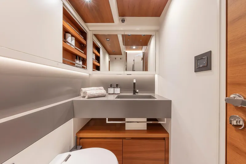  Yacht Photos Pics Luxurious bathroom interior of 2026 Pardo Yachts E60, featuring modern design and elegant fixtures.