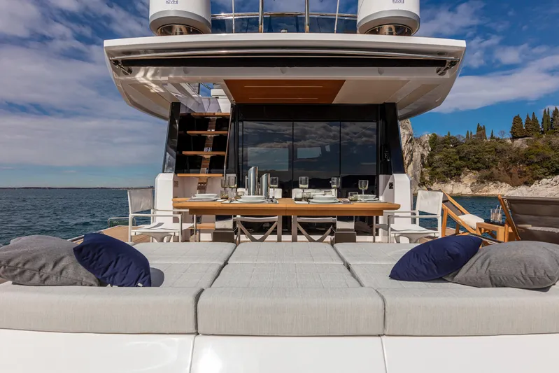  Yacht Photos Pics Luxurious 2026 Pardo Yachts E60 with elegant outdoor dining and lounging area.