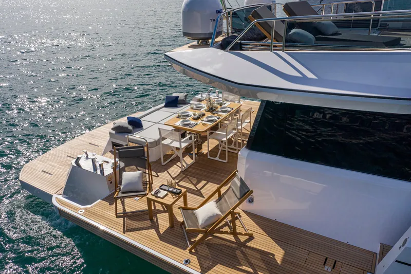  Yacht Photos Pics Luxurious 2026 Pardo Yachts E60 deck with elegant dining setup on the water.