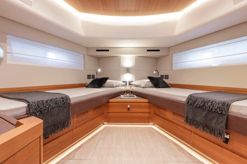  Yacht Photos Pics Luxurious interior of 2026 Pardo Yachts E60, featuring twin beds and elegant wood finishes.