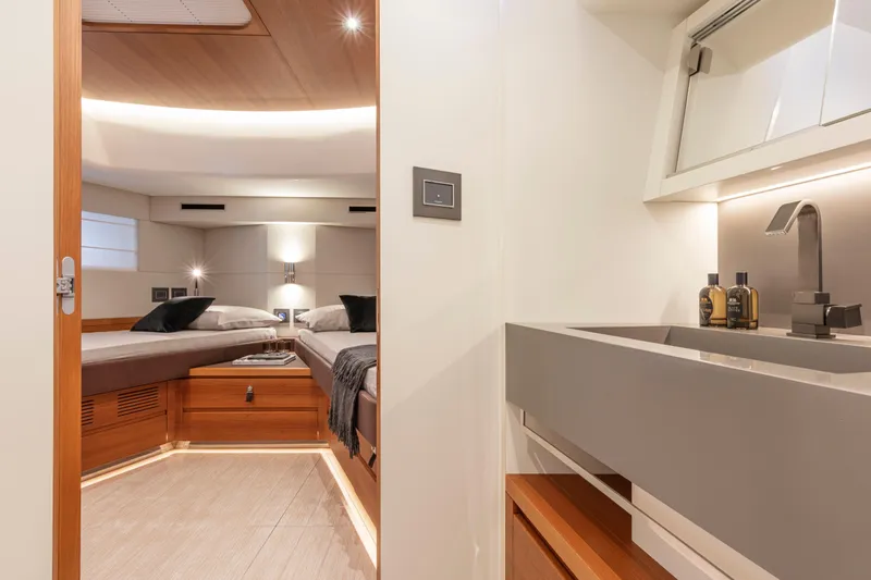  Yacht Photos Pics Luxurious interior of 2026 Pardo Yachts E60, featuring modern bedroom and sleek bathroom design.