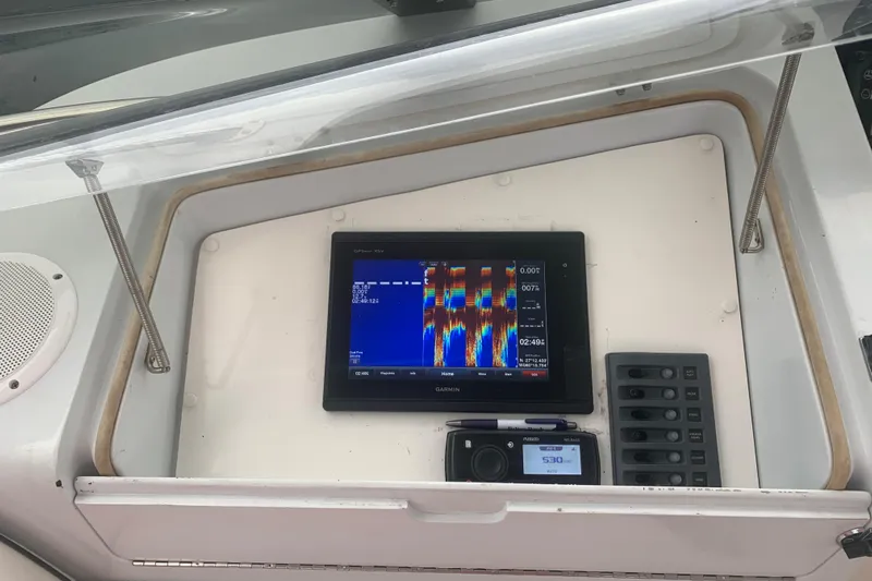  Yacht Photos Pics Control panel of a 1999 Hatteras 52 Cockpit Motor Yacht with Garmin display.