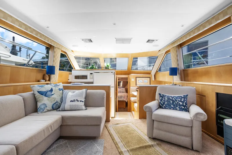  Yacht Photos Pics Interior of 1999 Hatteras 52 Cockpit Motor Yacht with cozy seating and modern decor.