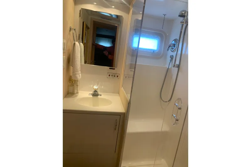  Yacht Photos Pics Bathroom interior of 1999 Hatteras 52 Cockpit Motor Yacht with shower and sink.