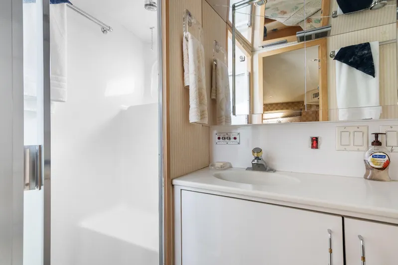  Yacht Photos Pics Bathroom interior of 1999 Hatteras 52 Cockpit Motor Yacht with sink and shower.