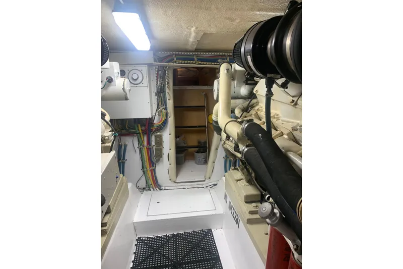  Yacht Photos Pics Engine room of 1999 Hatteras 52 Cockpit Motor Yacht with visible wiring and equipment.