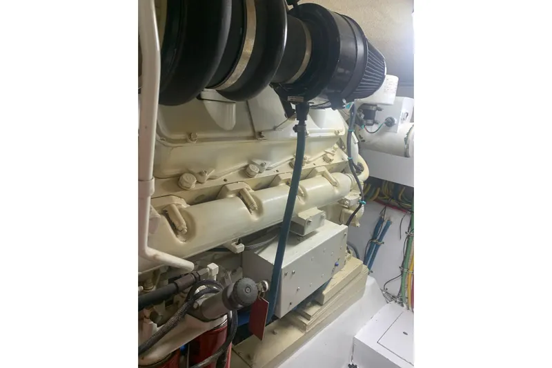  Yacht Photos Pics Engine room of 1999 Hatteras 52 Cockpit Motor Yacht with visible components and wiring.