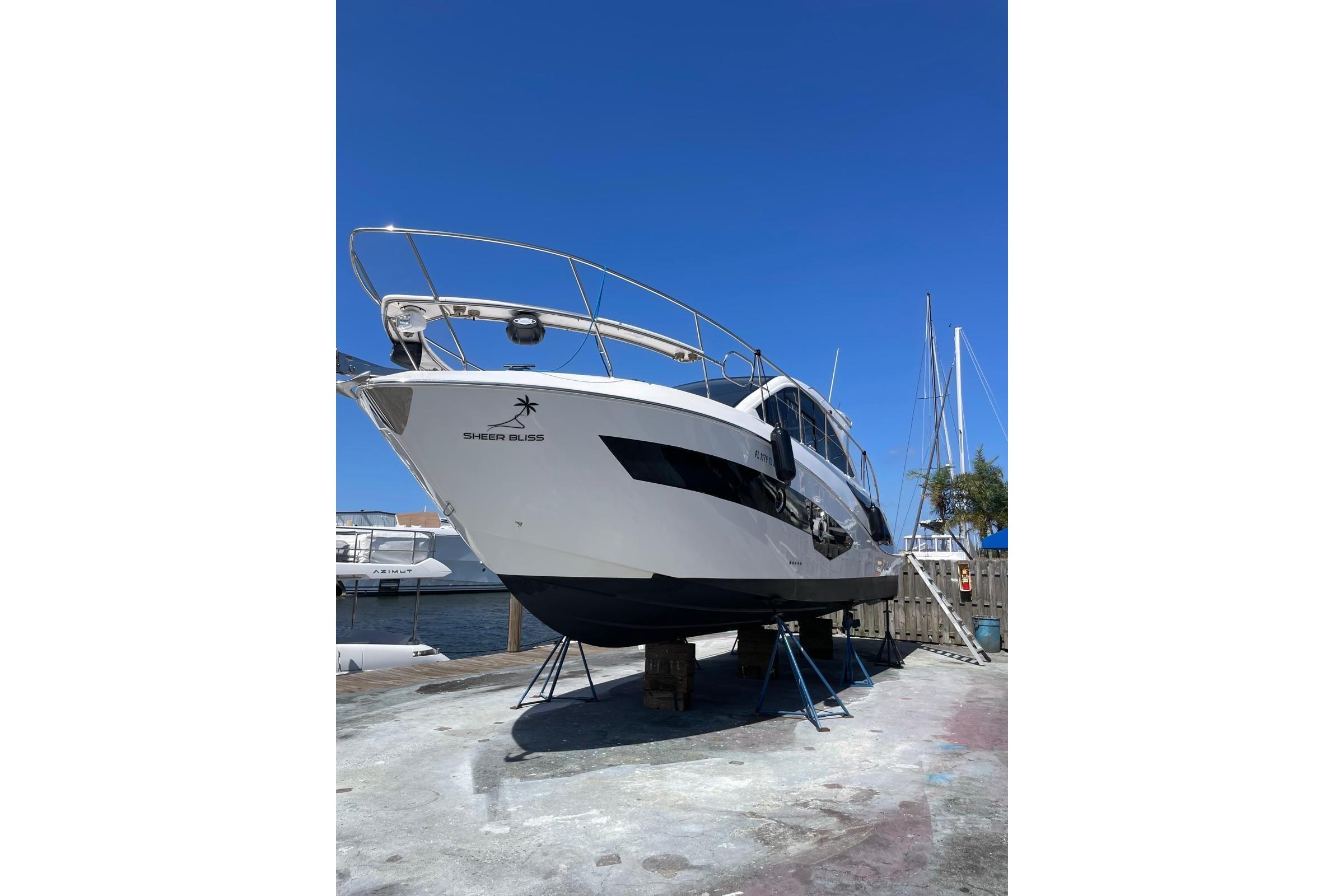 2023 Evolve 400HT yacht on dry dock under clear blue sky.