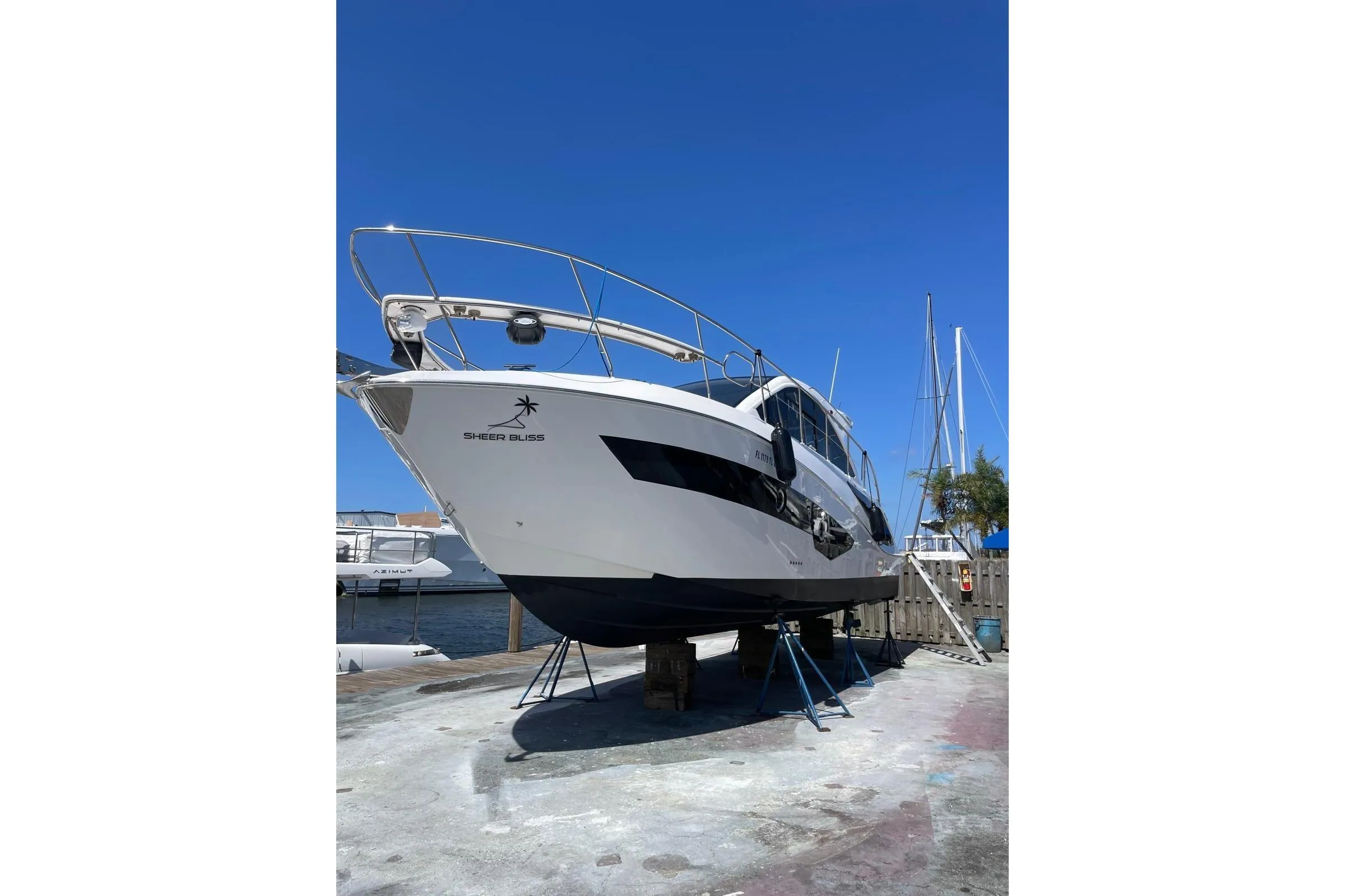 2023 Evolve 400HT yacht on dry dock under clear blue sky.