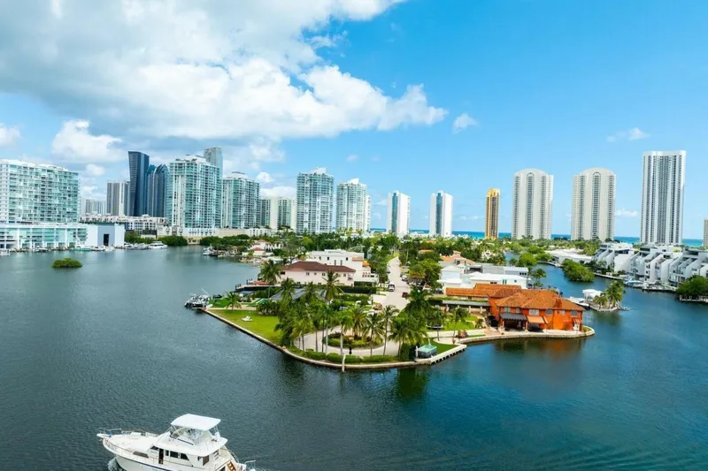 Dharma Yacht Photos Pics Aerial view of 1978 Hatteras 53 Yacht Fisherman near waterfront cityscape.