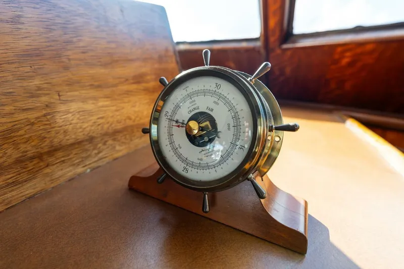 Dharma Yacht Photos Pics Vintage barometer on 1978 Hatteras 53 Yacht Fisherman, wooden interior background.