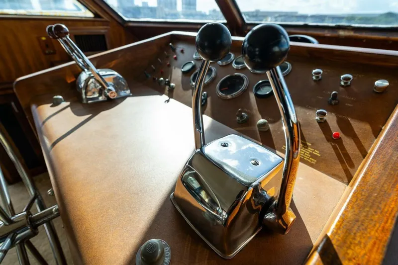 Dharma Yacht Photos Pics 1978 Hatteras 53 Yacht Fisherman helm with vintage controls and gauges.