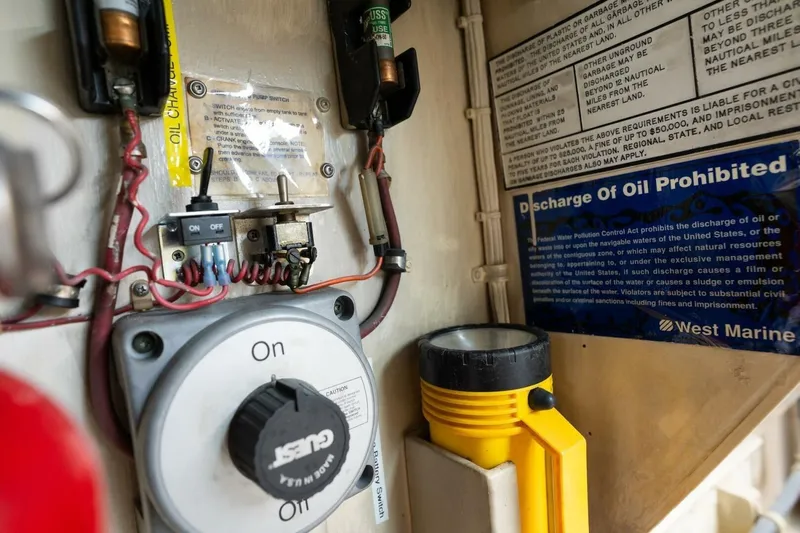 Dharma Yacht Photos Pics Control panel and warning signs inside a 1978 Hatteras 53 Yacht Fisherman.