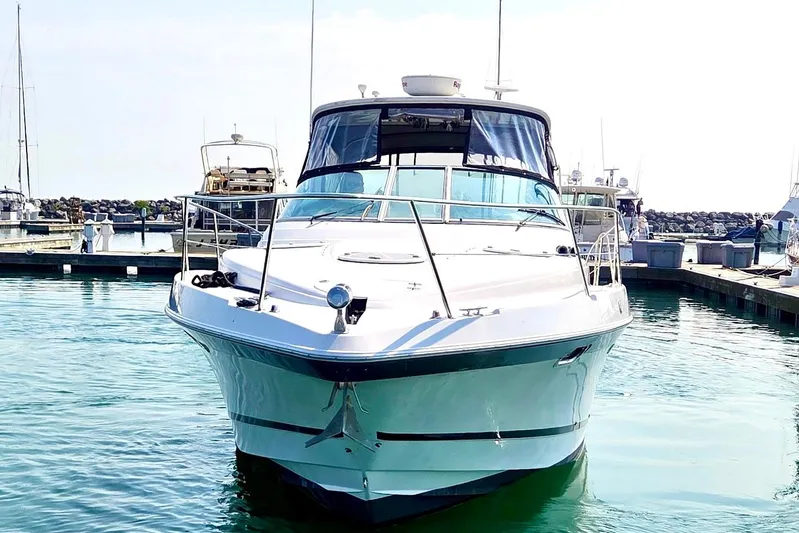 Fresh Off The Boat Yacht Photos Pics 2008 Four Winns 378 Vista yacht docked in a marina, front view.