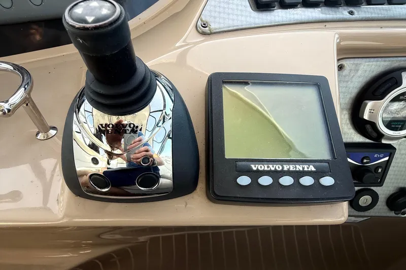 Fresh Off The Boat Yacht Photos Pics Control panel of a 2008 Four Winns 378 Vista boat with Volvo Penta joystick.