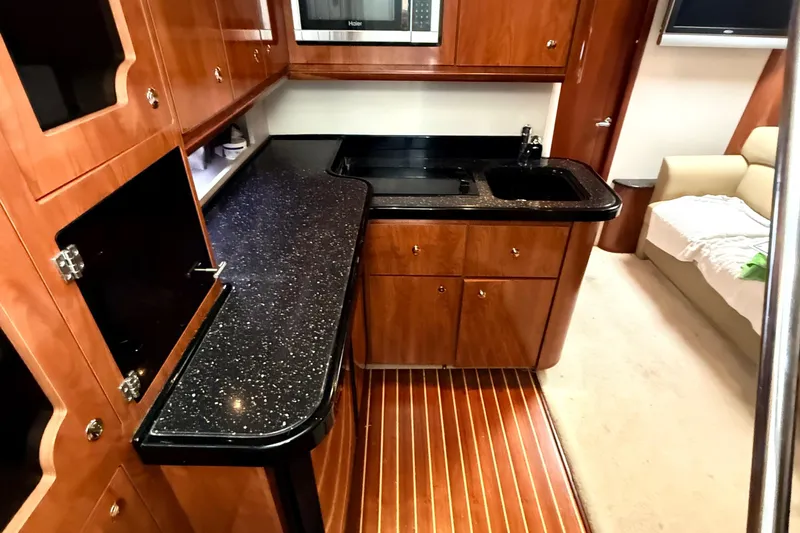 Fresh Off The Boat Yacht Photos Pics Luxurious 2008 Four Winns 378 Vista yacht interior with sleek kitchen and elegant wood finishes.