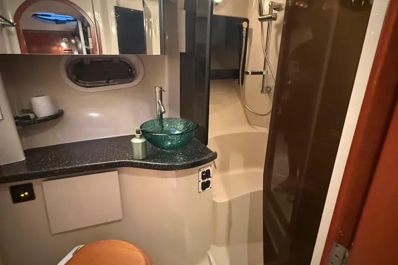 Fresh Off The Boat Yacht Photos Pics Luxurious bathroom in 2008 Four Winns 378 Vista yacht with modern fixtures and glass sink.