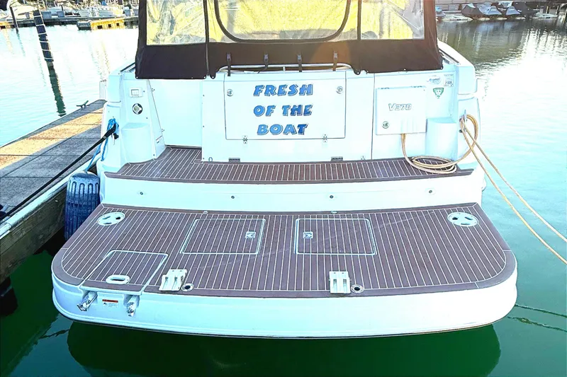 Fresh Off The Boat Yacht Photos Pics 2008 Four Winns 378 Vista boat docked, featuring "Fresh of the Boat" text on the stern.