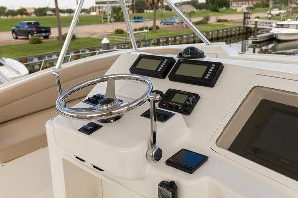 No Name Yacht Photos Pics Helm of 2008 Ocean Yachts 46SS with navigation instruments and steering wheel.