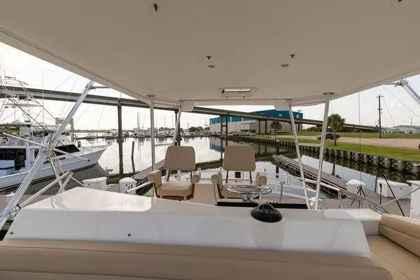 No Name Yacht Photos Pics 2008 Ocean Yachts 46SS yacht interior with marina view, featuring seating and helm station.