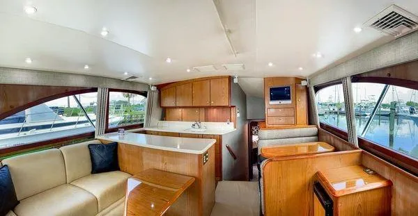 No Name Yacht Photos Pics Luxurious interior of 2008 Ocean Yachts 46SS with elegant wood finishes and spacious seating.