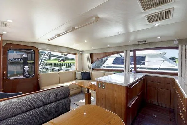 No Name Yacht Photos Pics Luxurious interior of 2008 Ocean Yachts 46SS with elegant seating and modern kitchen area.