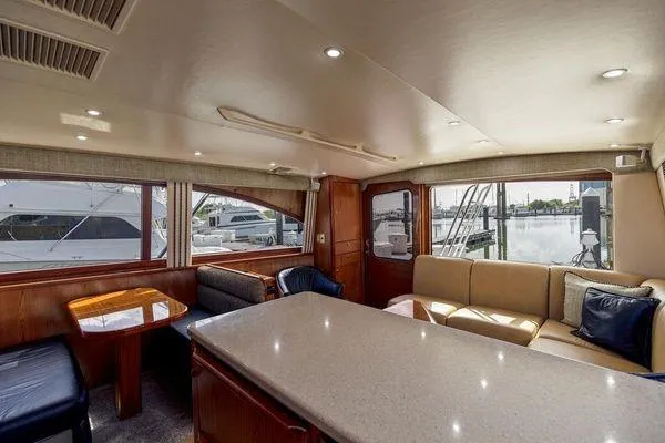 No Name Yacht Photos Pics Luxurious interior of 2008 Ocean Yachts 46SS with elegant seating and large windows.