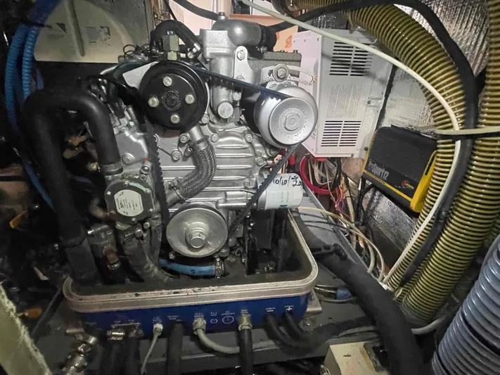 Gratitude Yacht Photos Pics Engine compartment of a 1999 Moody 46 CC sailboat, showcasing mechanical components and wiring.