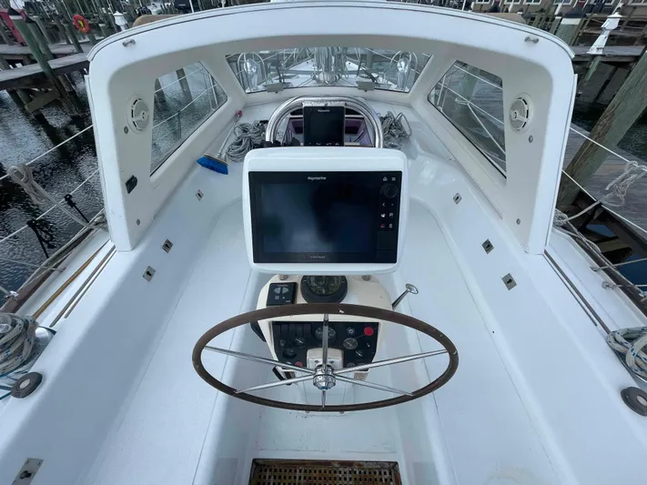 Gratitude Yacht Photos Pics Cockpit of 1999 Moody 46 CC sailboat with steering wheel and navigation equipment.