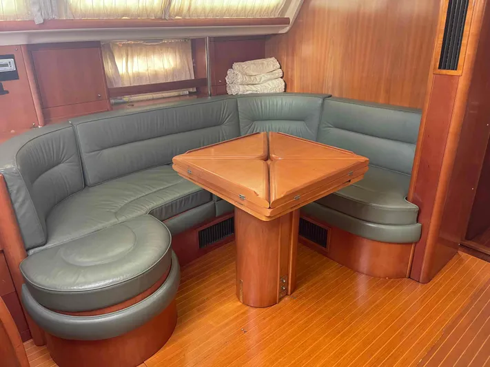 Gratitude Yacht Photos Pics Luxurious 1999 Moody 46 CC yacht interior with elegant wood and leather seating.