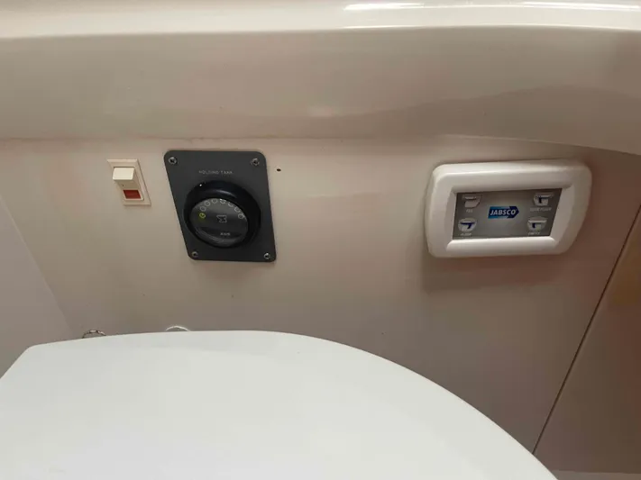 Gratitude Yacht Photos Pics Control panel and switches in a 1999 Moody 46 CC yacht bathroom.