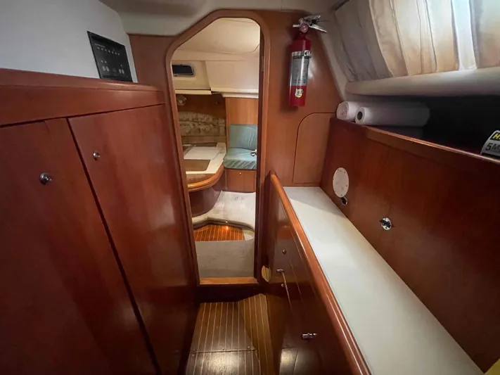 Gratitude Yacht Photos Pics Cozy interior of 1999 Moody 46 CC yacht with wooden cabinetry and seating area.