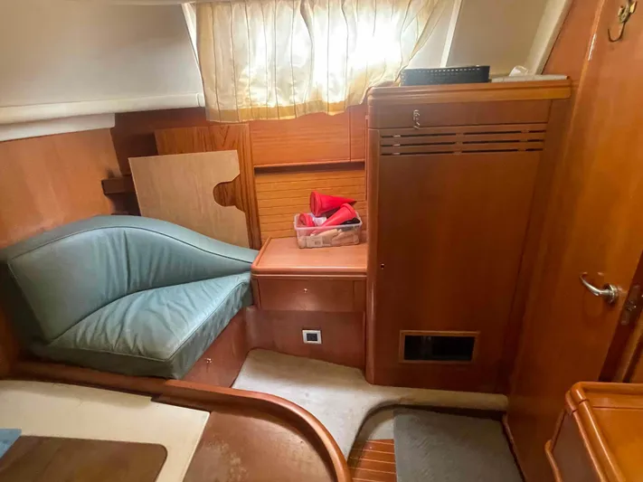 Gratitude Yacht Photos Pics Cozy interior of 1999 Moody 46 CC sailboat with wooden cabinetry and seating.